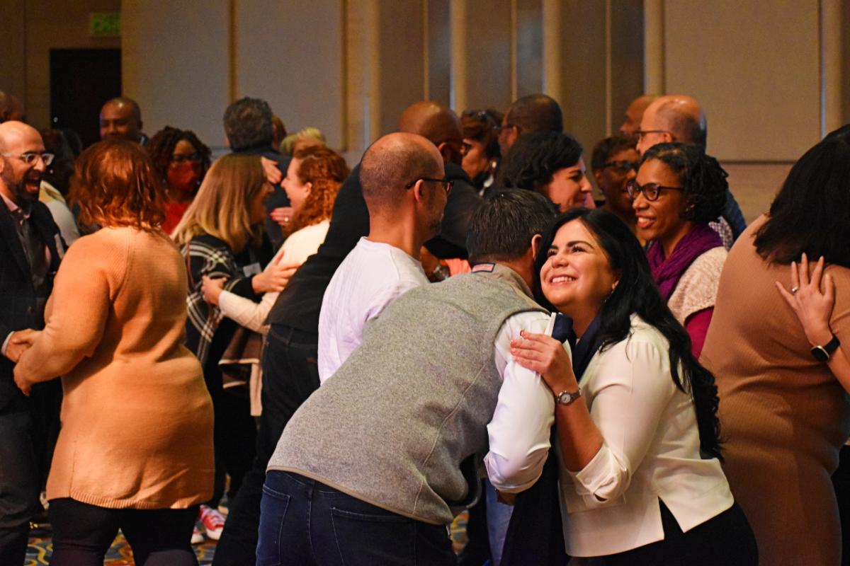 People hugging in group setting